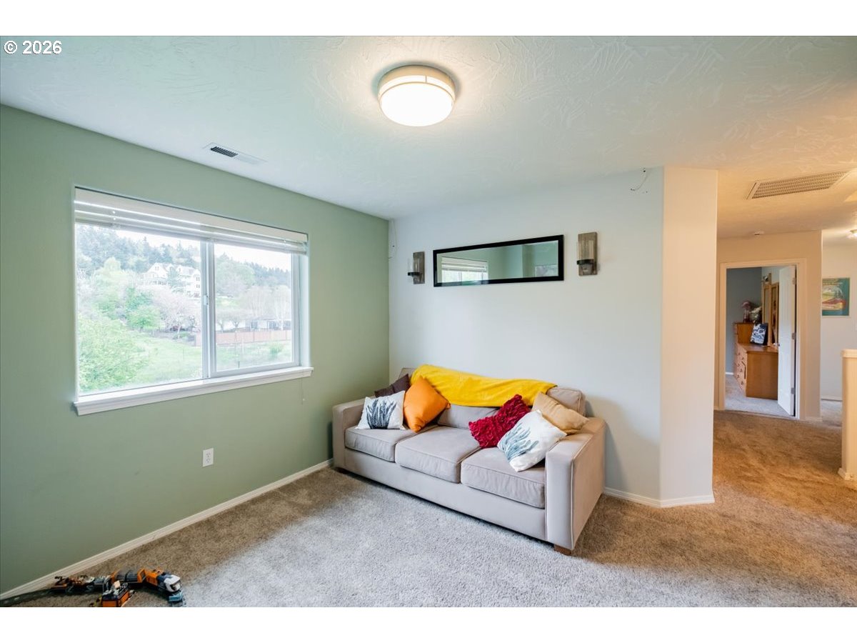 302 Division Street Northeast Silverton, OR 97381 - Photo 25 of 48 a living room with furniture and a window