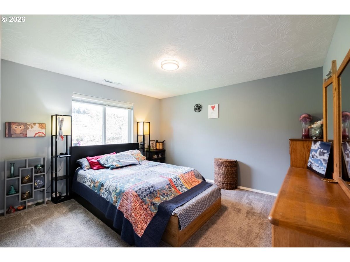 302 Division Street Northeast Silverton, OR 97381 - Photo 26 of 48 a bedroom with a bed and window