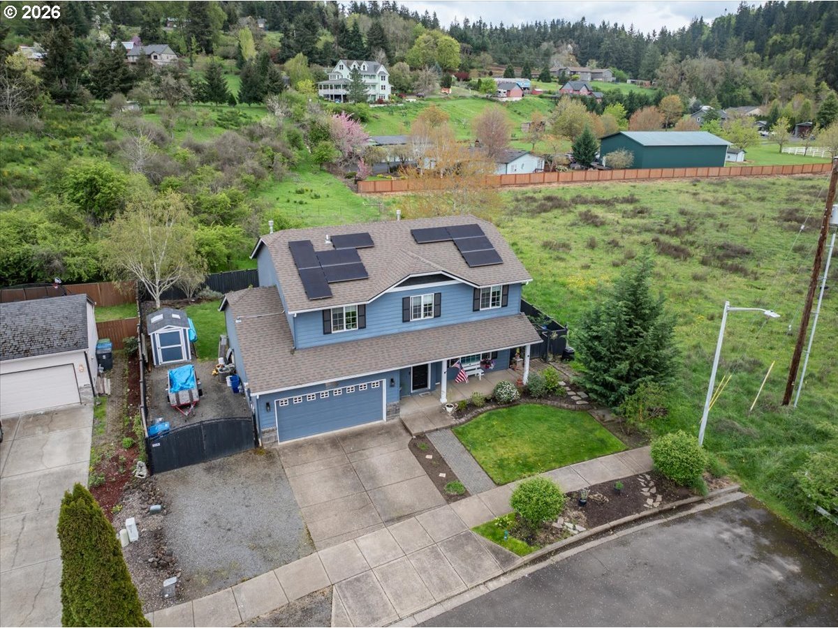 302 Division Street Northeast Silverton, OR 97381 - Photo 3 of 48 an aerial view of a house with garden space and street view