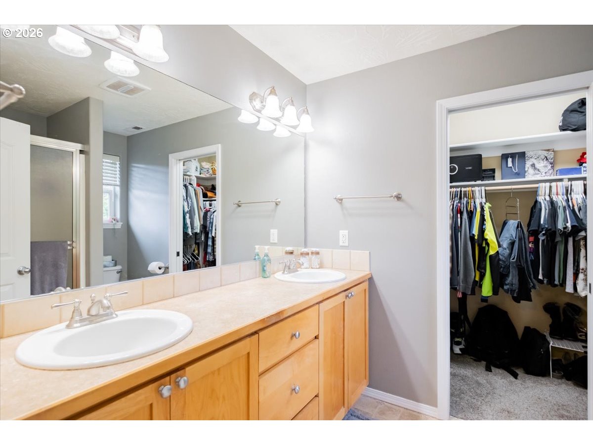 302 Division Street Northeast Silverton, OR 97381 - Photo 31 of 48 a bathroom with a sink double vanity and a mirror