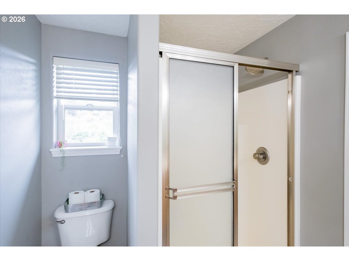302 Division Street Northeast Silverton, OR 97381 - Photo 33 of 48 a bathroom with a shower and a sink