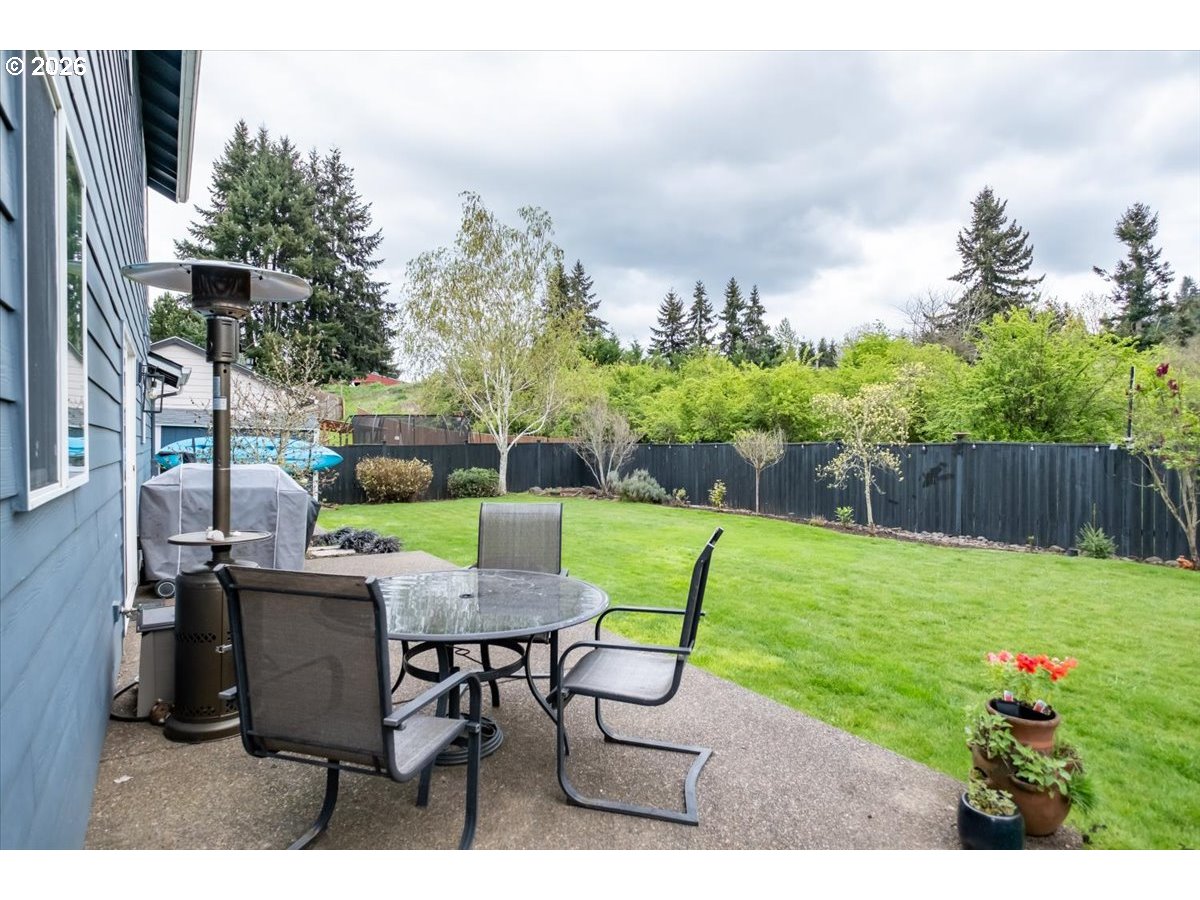 302 Division Street Northeast Silverton, OR 97381 - Photo 41 of 48 a view of a table and chairs in the garden