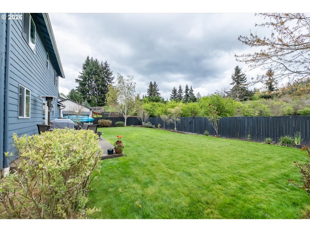 302 Division Street Northeast Silverton, OR 97381 - Photo 42 of 48 a view of a garden with a fountain