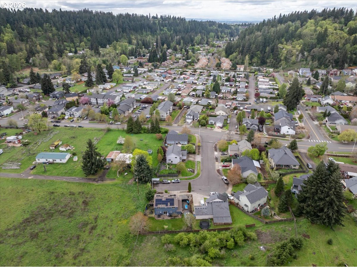 302 Division Street Northeast Silverton, OR 97381 - Photo 47 of 48 an aerial view of residential houses with outdoor space and trees