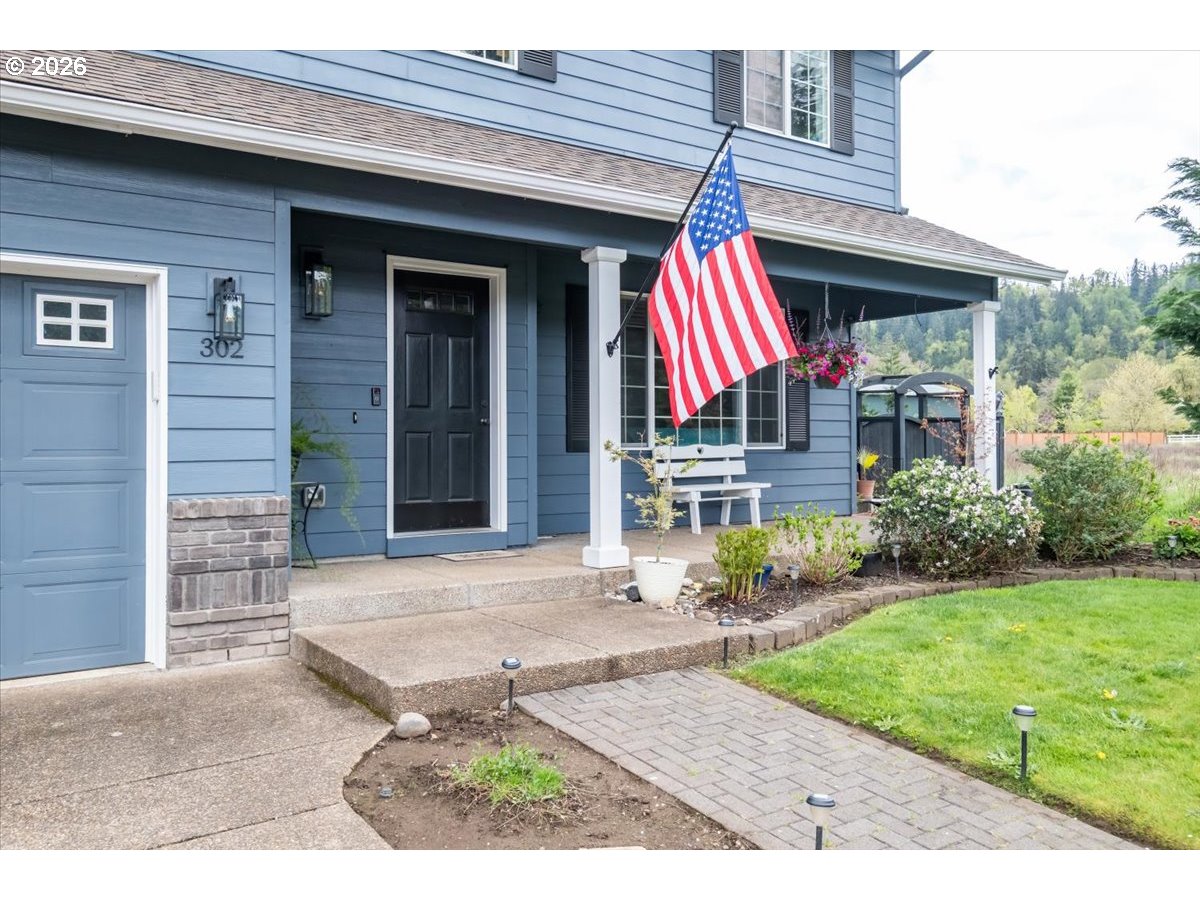 302 Division Street Northeast Silverton, OR 97381 - Photo 6 of 48 a view of a house with potted plants