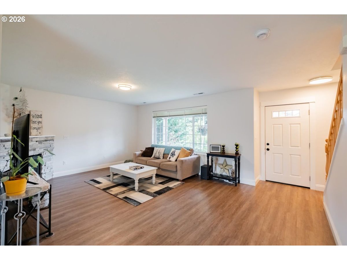302 Division Street Northeast Silverton, OR 97381 - Photo 8 of 48 a living room with furniture and a wooden floor