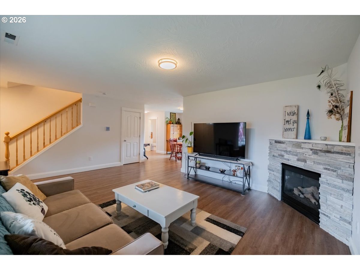302 Division Street Northeast Silverton, OR 97381 - Photo 10 of 48 a living room with furniture and a flat screen tv