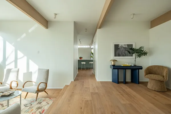 a view of a livingroom with furniture and windows