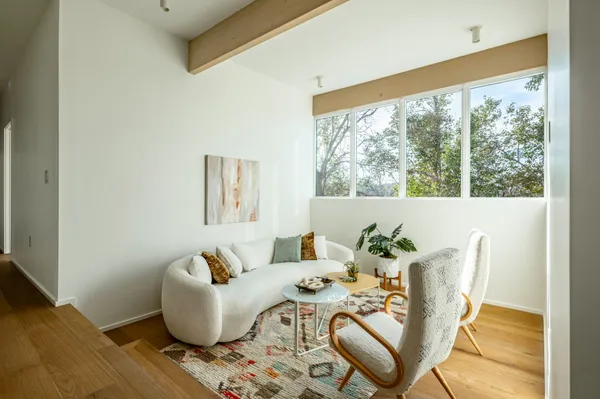 a living room with furniture and a large window