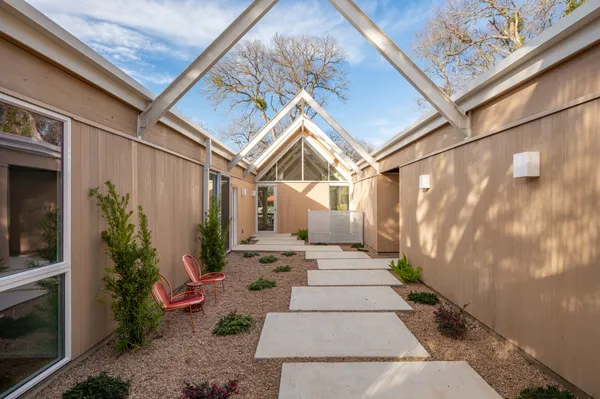 a view of a pathway with a house