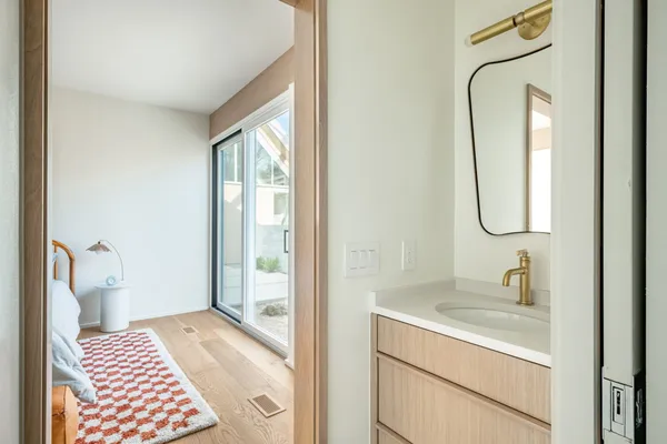 a bathroom with a sink and a mirror