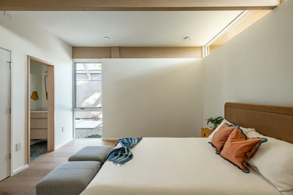 a room with a bed and a table in it