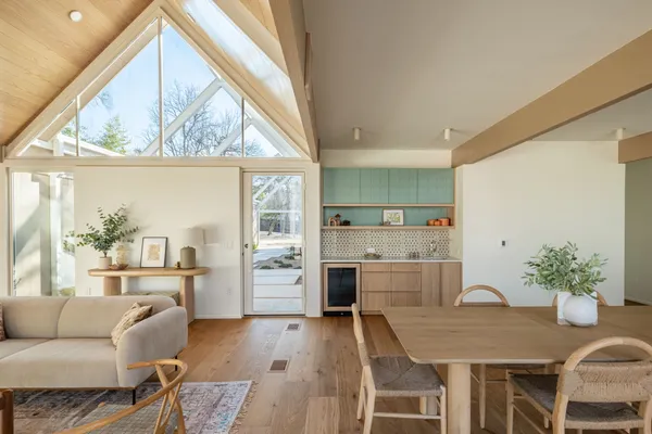 a dining room with furniture and window