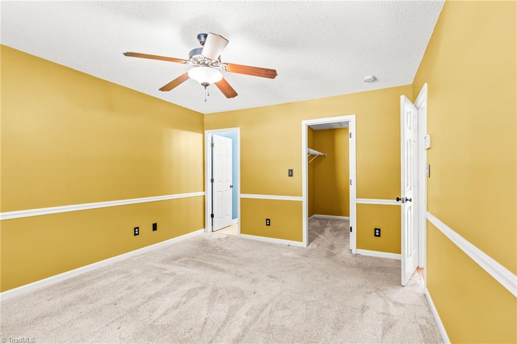 312 Old Camp Road Denton, NC 27239 - Photo 17 of 32 Primary bedroom has a huge walk in closet and private bathroom