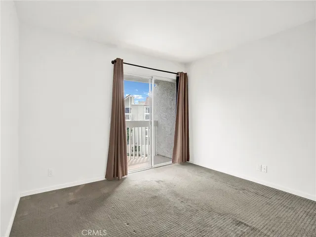 a view of a hallway with a door