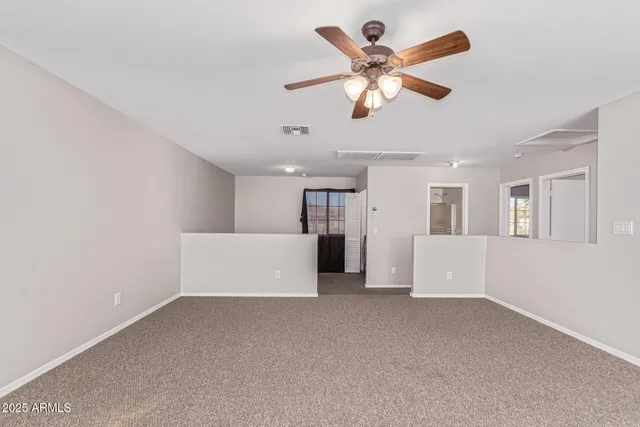 a view of a livingroom with a ceiling fan