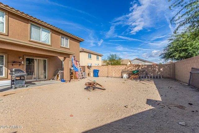 a view of a house with a yard covered in snow