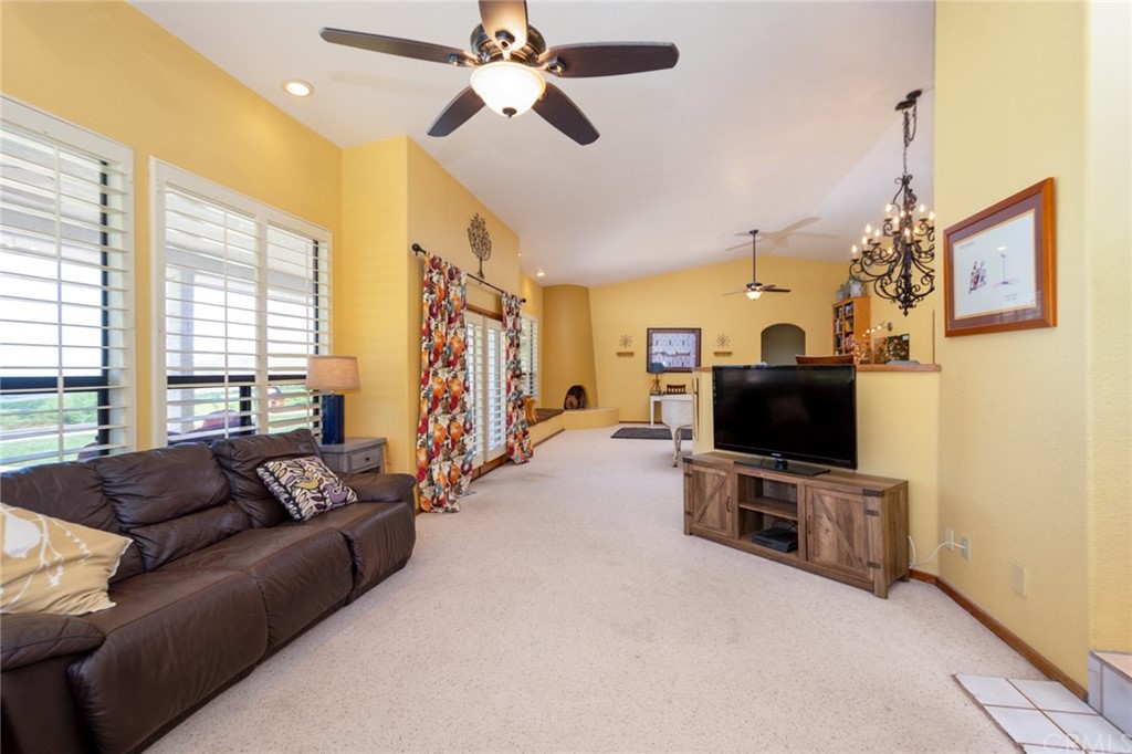 47810 Bee Canyon Truck Trail Hemet, CA 92544 - Photo 14 of 43 a living room with furniture and a flat screen tv