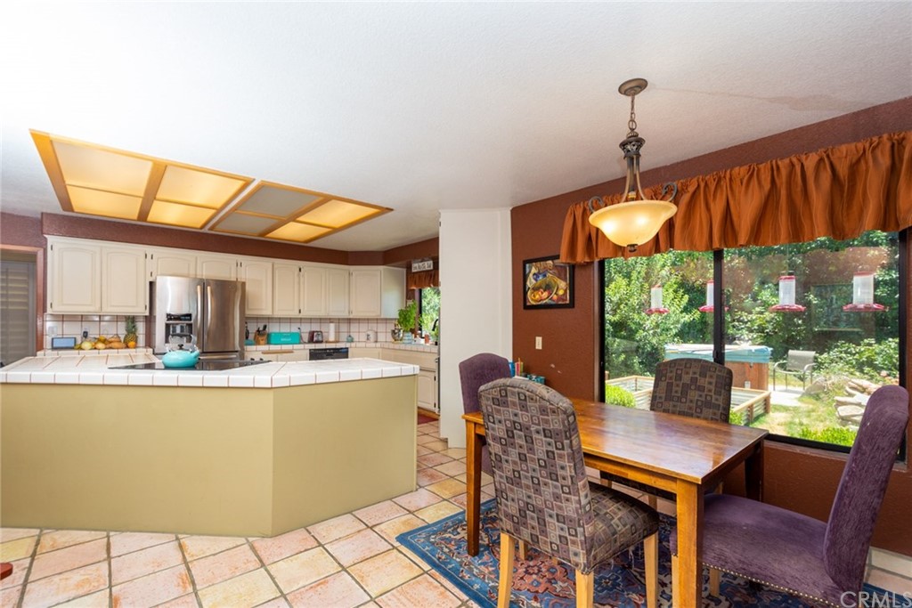 47810 Bee Canyon Truck Trail Hemet, CA 92544 - Photo 16 of 43 a dining room with furniture and a floor to ceiling window