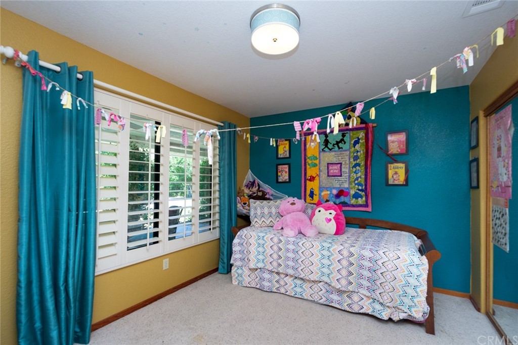 47810 Bee Canyon Truck Trail Hemet, CA 92544 - Photo 25 of 43 a bedroom with a bed dresser and a large window