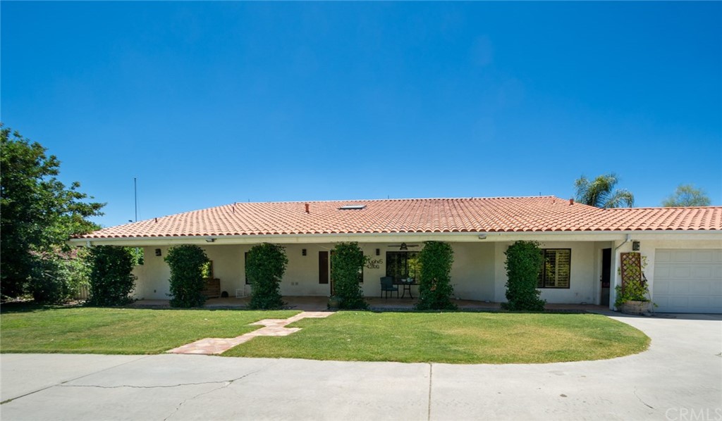 47810 Bee Canyon Truck Trail Hemet, CA 92544 - Photo 3 of 43 a front view of a house with a yard