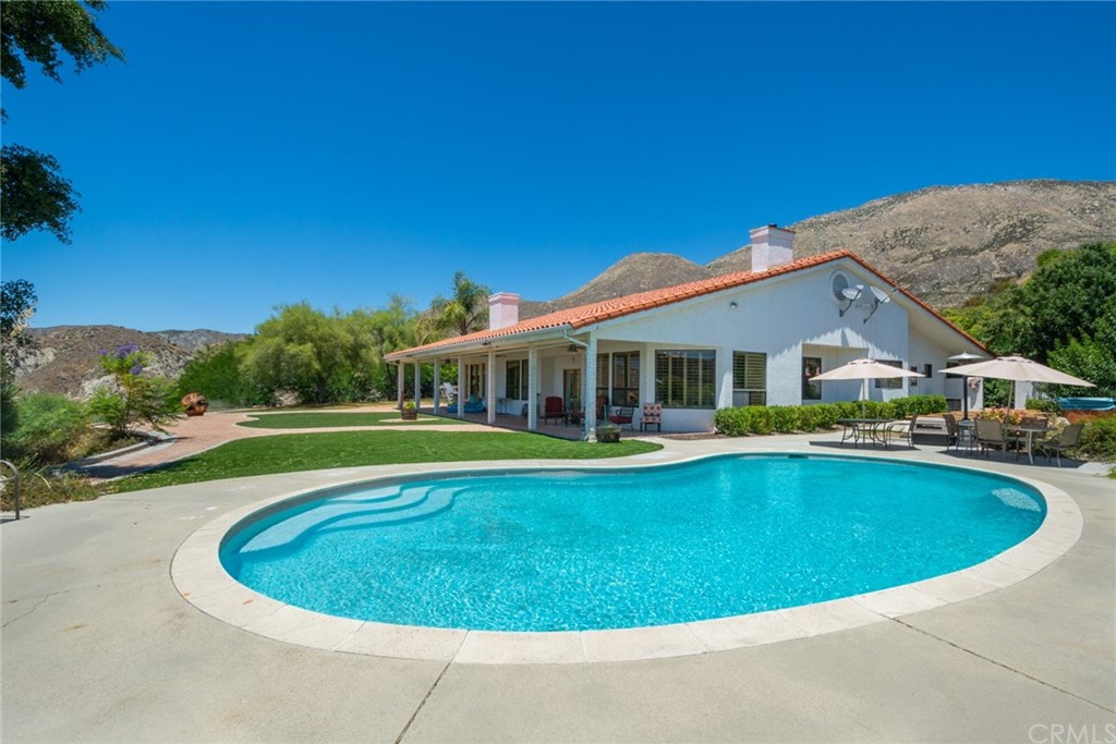 47810 Bee Canyon Truck Trail Hemet, CA 92544 - Photo 31 of 43 a view of a house with swimming pool and porch