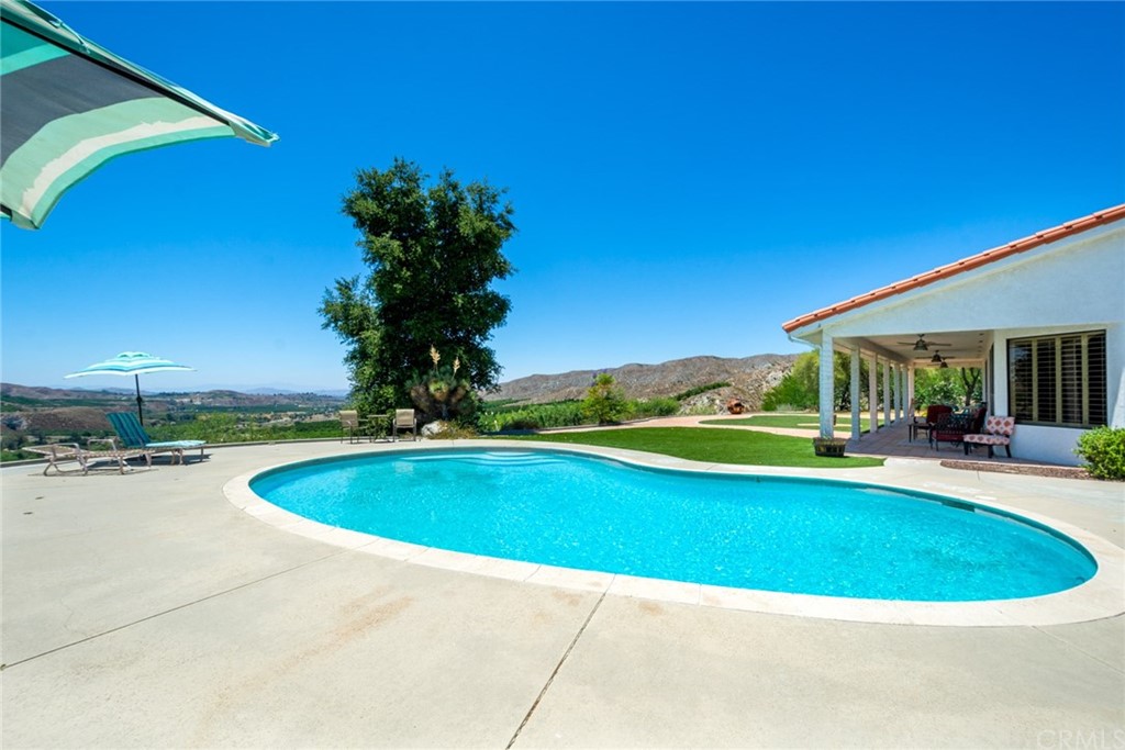 47810 Bee Canyon Truck Trail Hemet, CA 92544 - Photo 33 of 43 a view of a swimming pool with a patio