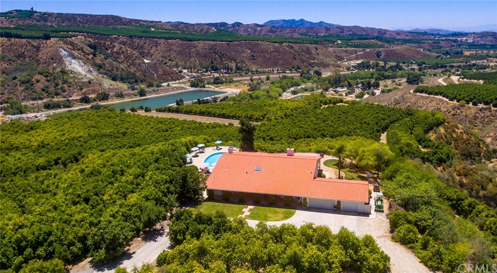 47810 Bee Canyon Truck Trail Hemet, CA 92544 - Photo 38 of 43 an aerial view of a house with a yard and lake view
