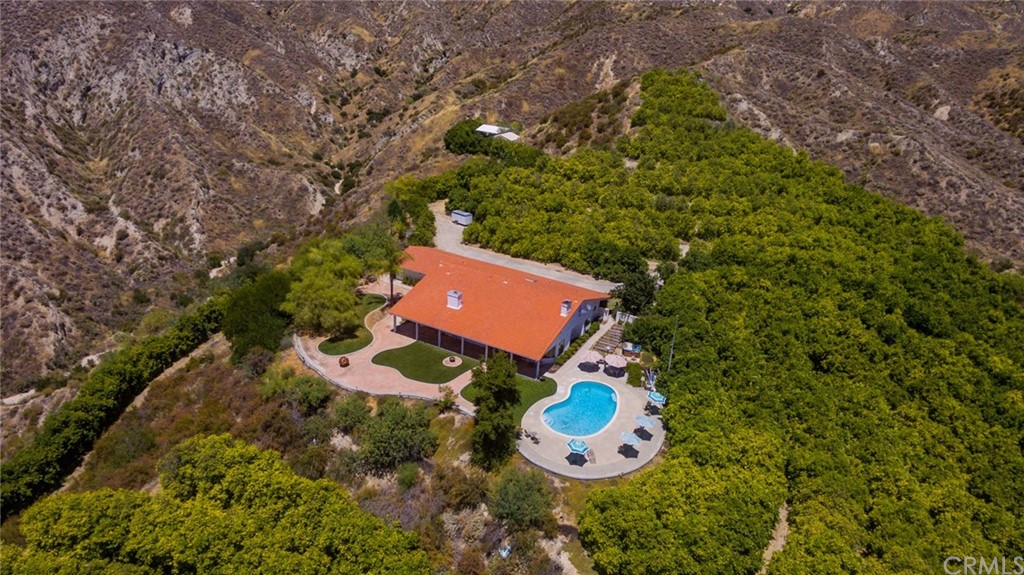 47810 Bee Canyon Truck Trail Hemet, CA 92544 - Photo 41 of 43 a aerial view of a house with garden space and sitting area