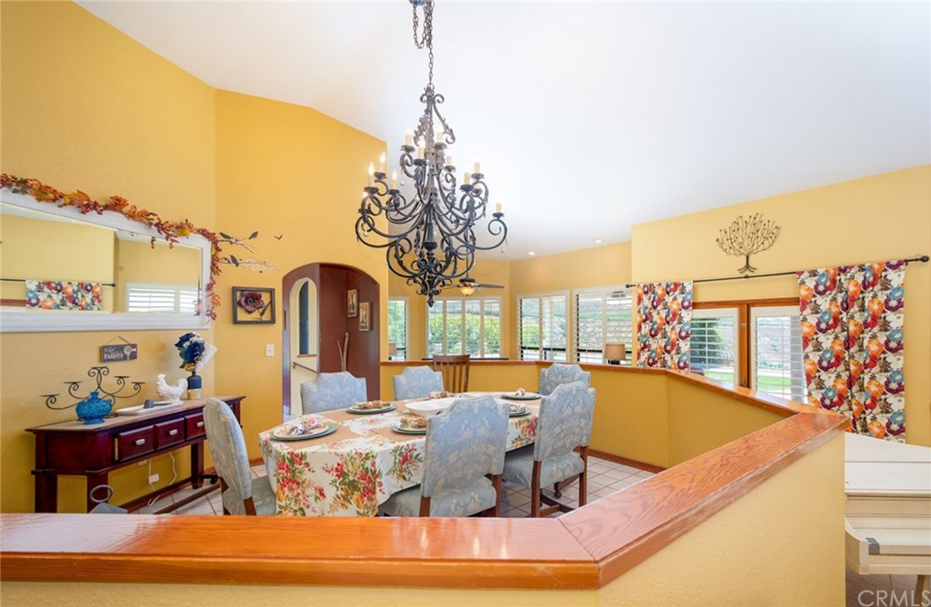 47810 Bee Canyon Truck Trail Hemet, CA 92544 - Photo 10 of 43 a view of a dining room with furniture a chandelier and wooden floor