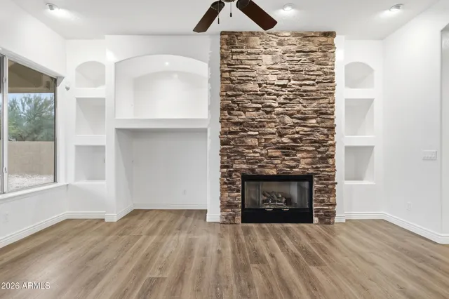 a view of a kitchen with a sink and a window