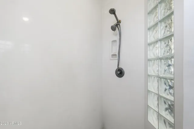 a view of a room with wooden floor and bathroom