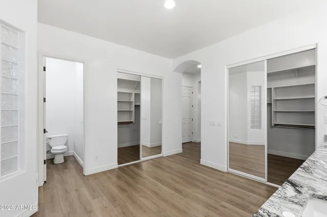 a view of a room with shelf on the wall