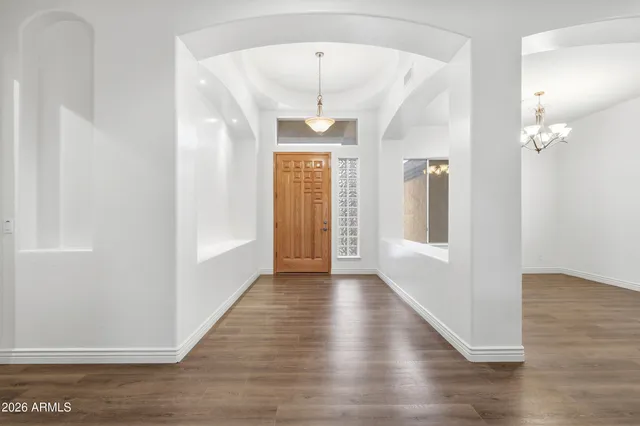 a view of a hallway view with wooden floor and staircase