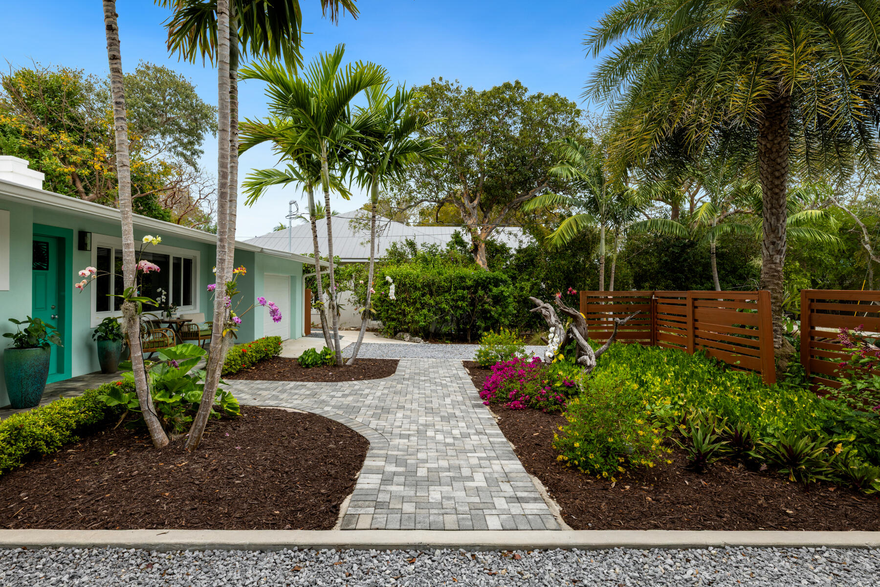 32 Park Road Islamorada, FL 33036 - Photo 23 of 48 a view of a backyard with potted plants and large trees