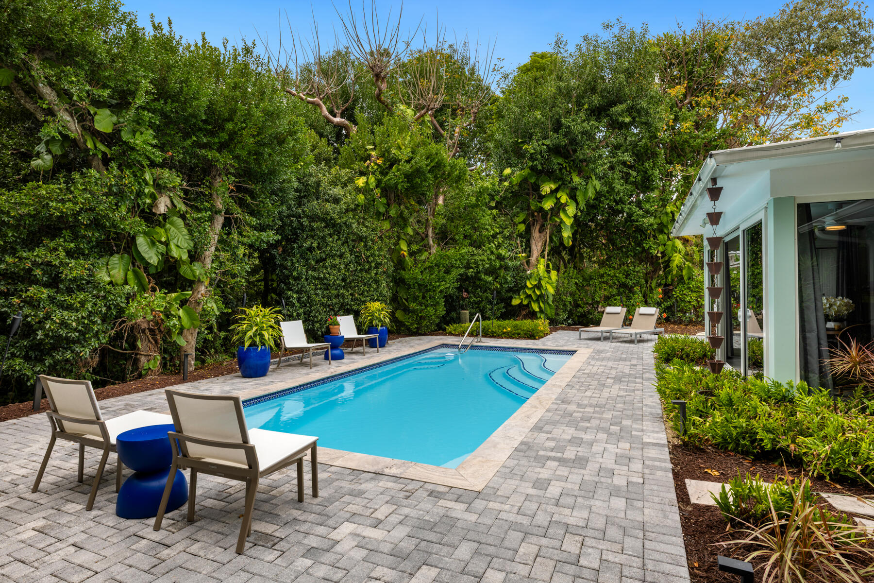 32 Park Road Islamorada, FL 33036 - Photo 24 of 48 a view of a swimming pool with a lounge chair