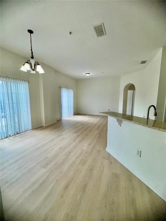 6404 South Goldenrod Road, Unit 2A Orlando, FL 32822 - Photo 13 of 40 a view of a room with a sink and chandelier