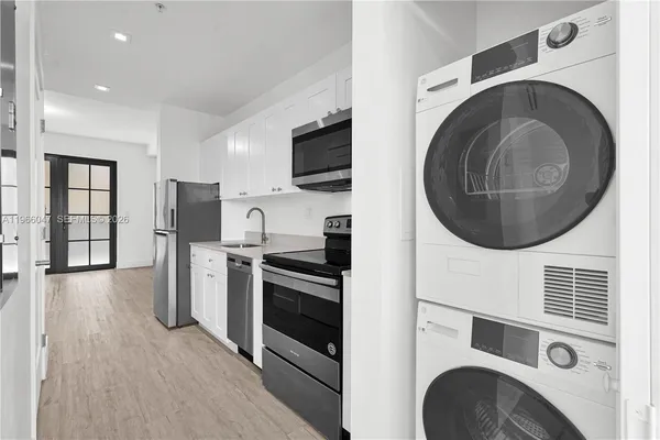 a view of kitchen with washer and dryer