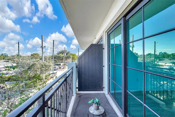 a view of balcony with furniture