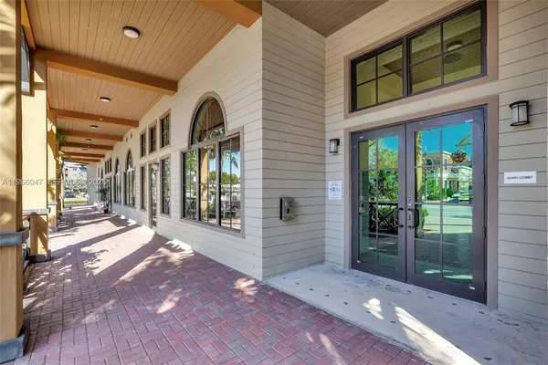 a view of a brick house with a large window