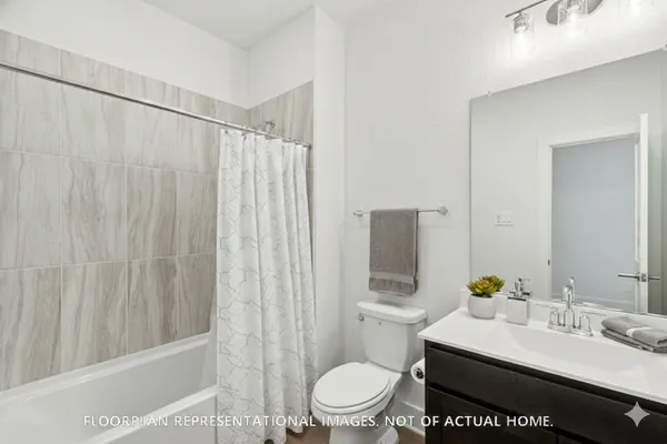 a view of a street with houses in the background