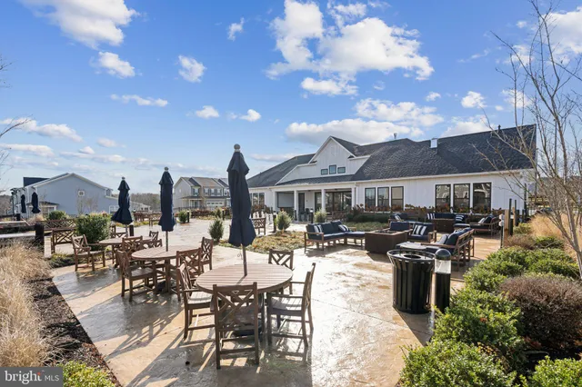 a view of a patio with chairs and tables