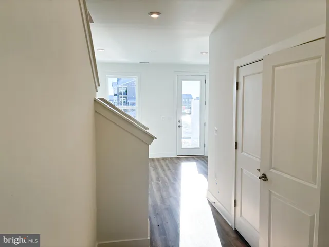 a view of a hallway with windows