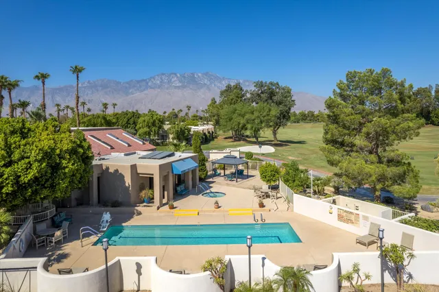 a aerial view of a house with swimming pool