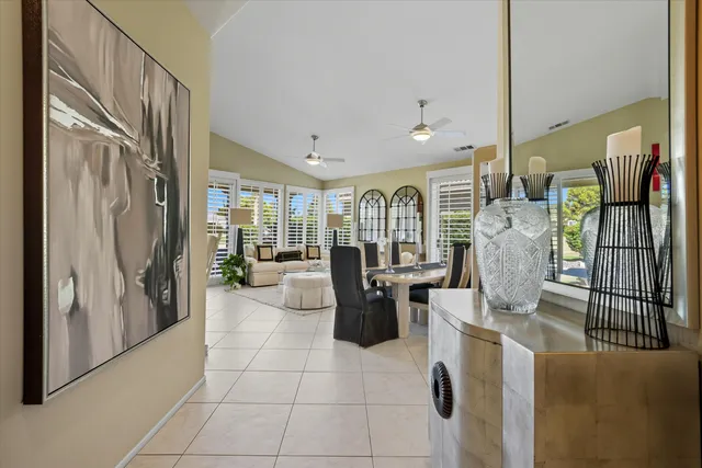 a lobby with furniture and a potted plant