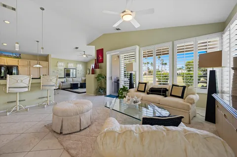 a view of a dining room with furniture and window
