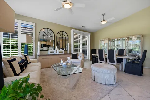 a kitchen with stainless steel appliances kitchen island granite countertop a sink and cabinets