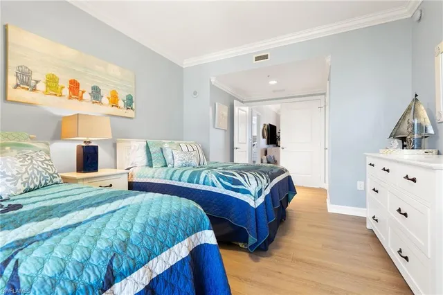 a spacious bedroom with a bed and a couch