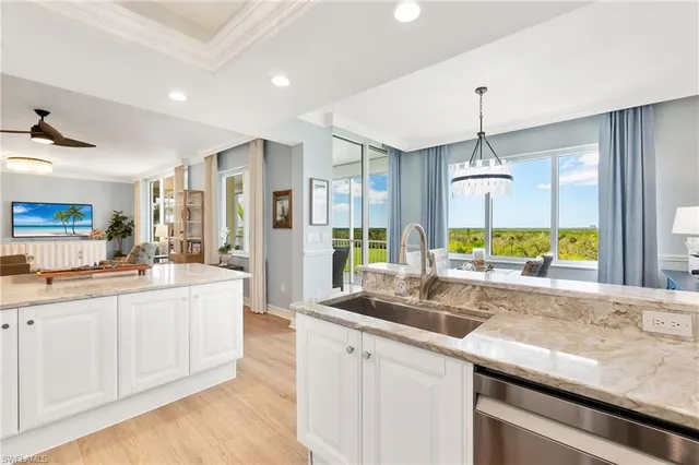 a kitchen with counter top space and sink
