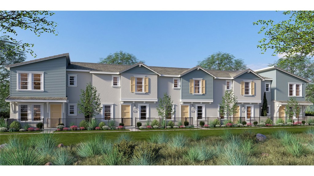 15535 April Dawn Way, Unit 1 Fontana, CA 92336 - Photo 15 of 16 a front view of a house with a yard